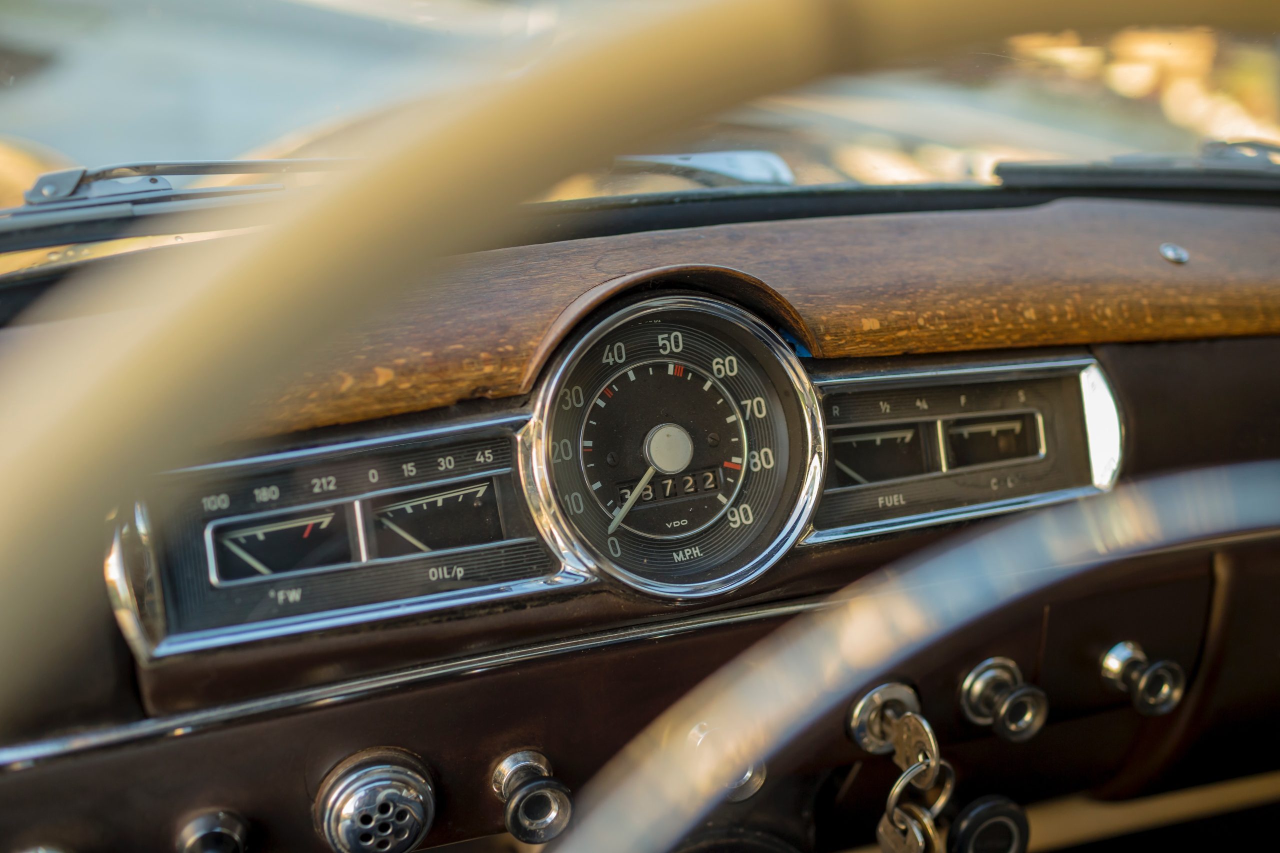 retro car steering wheel and dashboard